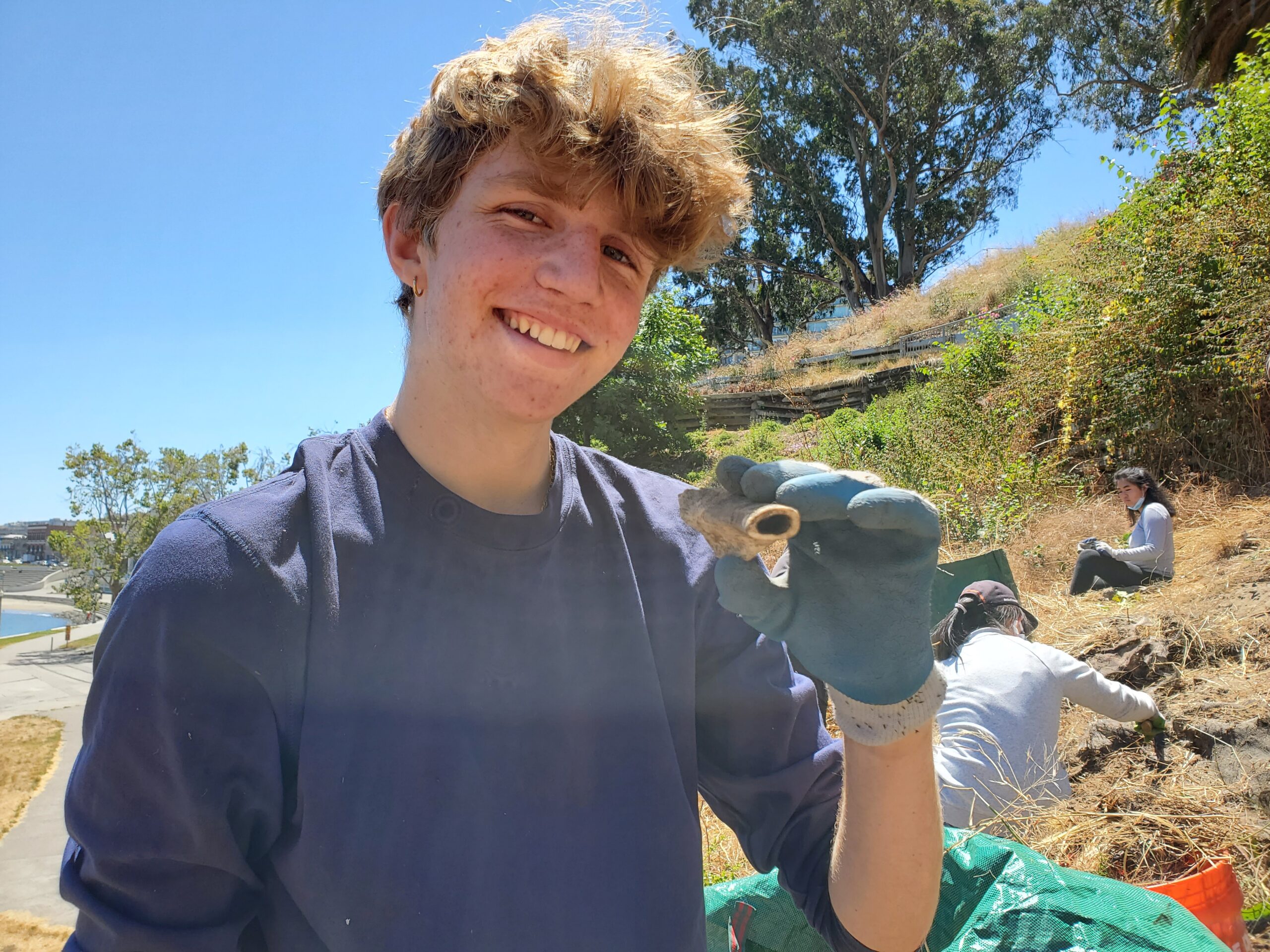 Teen holding fossil Climate Career Corps